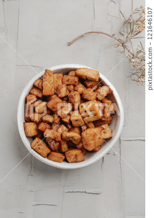 white ceramic bowl with marinated tofu cubes 121646107