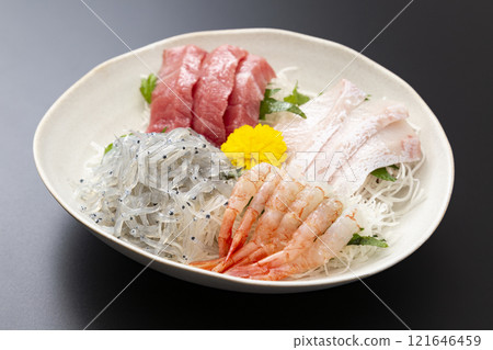 Assorted sashimi on a black background Assorted sashimi on a black background 121646459