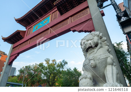 Montreal, Quebec, Canada - August 11 2021 : Street view of Montreal's Chinatown. North Paifang, the arch gate of Chinatown on Saint Laurent Boulevard. Montreal, Quebec, Canada - August 11 2021 : Street view of Montreal's Chinatown. North Paifang, the arch gate of Chinatown on Saint Laurent Boulevard. 121646518
