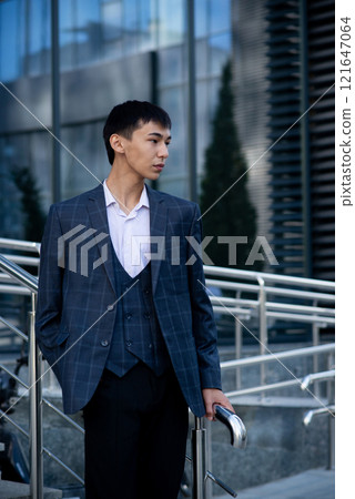 Oriental asian man in suit in downtown Oriental asian man in suit in downtown 121647064