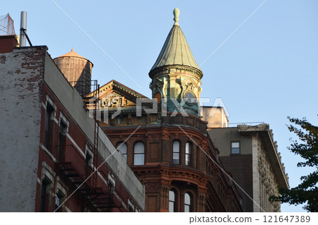 Historic buildings on one of the iconic streets in New York City, Manhattan reportage photography, modern cityscape, famous skyscrapers, Manhattan, NYC, NY, USA Historic buildings on one of the iconic streets in New York City, Manhattan reportage photography, modern cityscape, famous skyscrapers, Manhattan, NYC, NY, USA 121647389