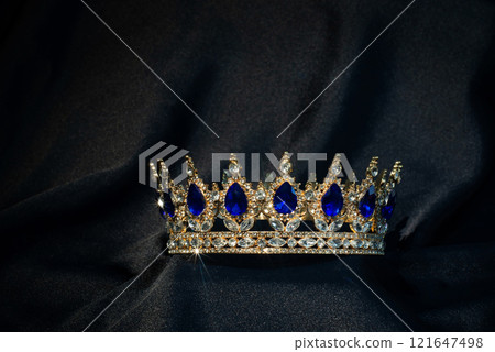 Royal crown for queen and king with blue gemstones, Sapphires..  121647498