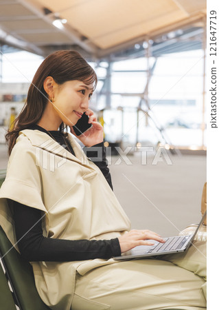 Woman working before going on vacation 121647719