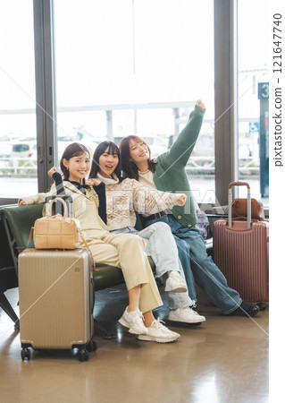 Image of girls excited before leaving on a trip Image of girls excited before leaving on a trip 121647740
