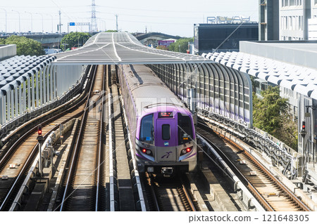 View of a Taoyuan International Airport line train running on the elevated track of the Taoyuan Mass Rapid Transit System. View of a Taoyuan International Airport line train running on the elevated track of the Taoyuan Mass Rapid Transit System. 121648305