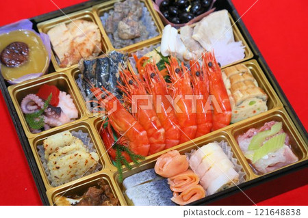 A luxurious New Year's Osechi meal from a luxurious restaurant, packed in a tiered box, and a colorful assortment of Japanese-style Kaiseki cuisine dishes A luxurious New Year's Osechi meal from a luxurious restaurant, packed in a tiered box, and a colorful assortment of Japanese-style Kaiseki cuisine dishes 121648838