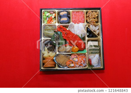 A luxurious New Year's Osechi meal from a luxurious restaurant, packed in a tiered box, and a colorful assortment of Japanese-style Kaiseki cuisine dishes A luxurious New Year's Osechi meal from a luxurious restaurant, packed in a tiered box, and a colorful assortment of Japanese-style Kaiseki cuisine dishes 121648843