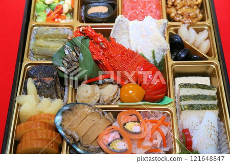 A luxurious New Year's Osechi meal from a luxurious restaurant, packed in a tiered box, and a colorful assortment of Japanese-style Kaiseki cuisine dishes 121648847