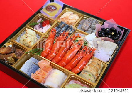 A luxurious New Year's Osechi meal from a luxurious restaurant, packed in a tiered box, and a colorful assortment of Japanese-style Kaiseki cuisine dishes 121648851