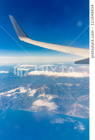 View from the airplane window of the mountains and sea resort with corals in Egypt, Sharm El Sheikh.Flight 121648934