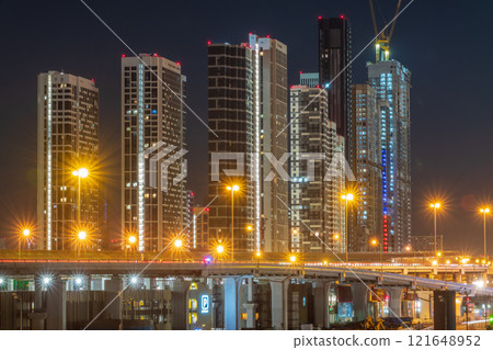 The scyscrapers of the Moscow City at night and the Dorogomilovsky bridge with illumination. Translation of text - street names: Krasnopresnenskaya, center, etc. The scyscrapers of the Moscow City at night and the Dorogomilovsky bridge with illumination. Translation of text - street names: Krasnopresnenskaya, center, etc. 121648952