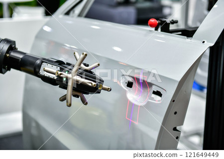 3D scanner on robotic arm measure the accuracy of automotive parts. in industrial plants 3D scanner on robotic arm measure the accuracy of automotive parts. in industrial plants 121649449