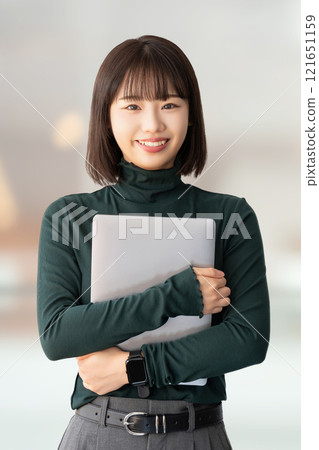 Smiling woman/businesswoman with a laptop 121651159