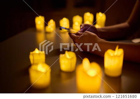 Experience a serene ambiance created by a combination of candlelight and advanced technology Experience a serene ambiance created by a combination of candlelight and advanced technology 121651680