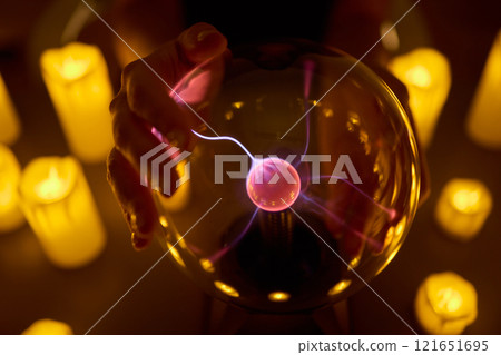 Experience a Mystical Scene with an Energy Ball and Candles, evoking Spiritual Vibes Experience a Mystical Scene with an Energy Ball and Candles, evoking Spiritual Vibes 121651695