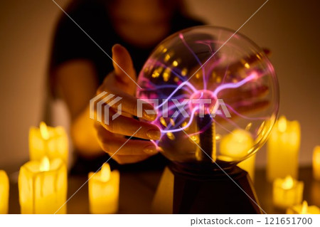 Experience a Mystical Scene with an Energy Ball and Candles, evoking Spiritual Vibes Experience a Mystical Scene with an Energy Ball and Candles, evoking Spiritual Vibes 121651700