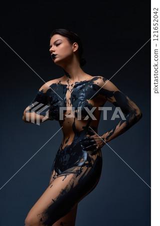 Body painting with naked woman embracing herself against grau backgruond Body painting with naked woman embracing herself against grau backgruond 121652042