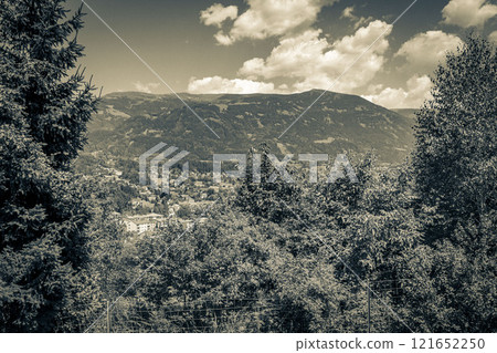 Wonderful wooded mountain alpine panorama with village and huts Austria. Wonderful wooded mountain alpine panorama with village and huts Austria. 121652250