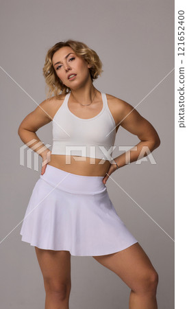 A Sporty Model Wearing Chic Athletic Wear is Posing Confidently with Style and Grace 121652400