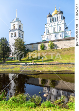 View of the medieval Pskov Kremlin (Krom) and the embankment of the Pskova river in summer day. Pskov, Russia 121652844