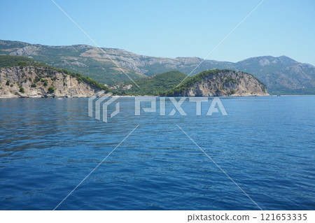 RT Dubovica Rocks near Buljarica and Svetac Rock, Montenegro. Stones inaccessible rocks. Flysch marine lithological layers. Adriatic Mediterranean sea blue water. Nature park Katici. District Budva RT Dubovica Rocks near Buljarica and Svetac Rock, Montenegro. Stones inaccessible rocks. Flysch marine lithological layers. Adriatic Mediterranean sea blue water. Nature park Katici. District Budva 121653335