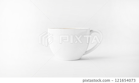 A minimalist white coffee cup is placed on a smooth surface, ideal for showcasing branding designs or themes in a clean, artistic manner A minimalist white coffee cup is placed on a smooth surface, ideal for showcasing branding designs or themes in a clean, artistic manner 121654073