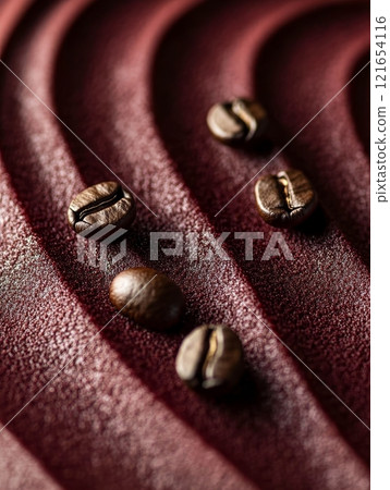 Luxurious mocha mousse is elegantly displayed, showcasing rich textures and a scattering of coffee beans on a smooth, dark backdrop 121654116