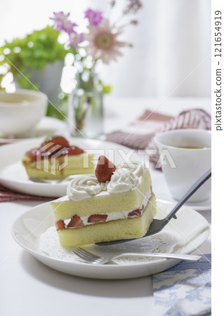 Shortcake served on a plate, vertical position 121654919