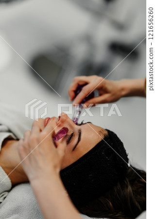 Facial treatment with microneedling session in a spa environment Facial treatment with microneedling session in a spa environment 121656260