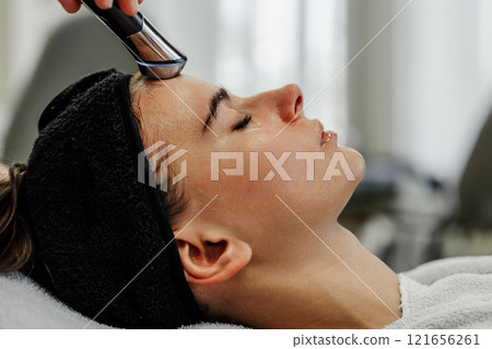 Relaxing Skincare Treatment Session Taking Place in a Modern Spa Setting During the Afternoon Relaxing Skincare Treatment Session Taking Place in a Modern Spa Setting During the Afternoon 121656261