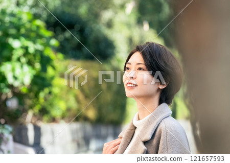 A woman walking outdoors A woman walking outdoors 121657593