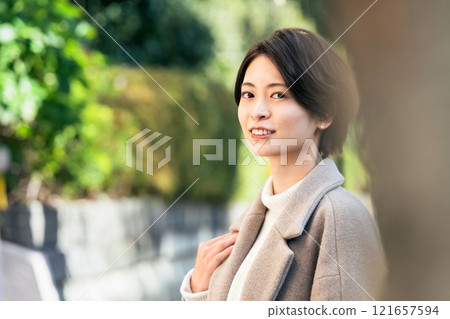 A woman walking outdoors A woman walking outdoors 121657594
