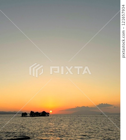 Sunset over the lake Sunset over the lake 121657934