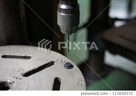 Drilling a hole in the resin 121658372