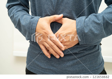 Hernia, Asian man stomach ache, abdominal pain and urology problem health. 121658682