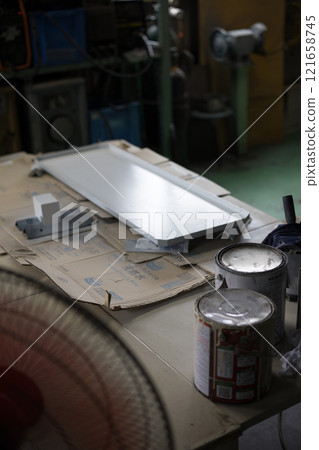 Painting the manufactured parts 121658745