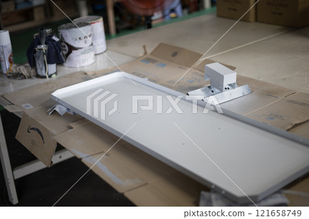 Painting the manufactured parts 121658749