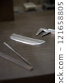 Measuring the dimensions of parts with calipers 121658805