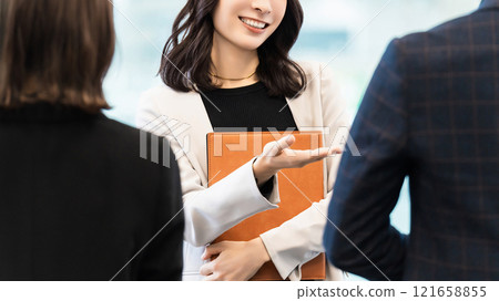 Three male and female businessmen making meetings 121658855