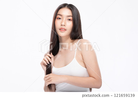 Radiant Asian woman with a captivating smile and healthy, lustrous hair. Exuding confidence and natural beauty, perfect for beauty campaigns and lifestyle . Self Care Concept.Isolated on white Radiant Asian woman with a captivating smile and healthy, lustrous hair. Exuding confidence and natural beauty, perfect for beauty campaigns and lifestyle . Self Care Concept.Isolated on white 121659139