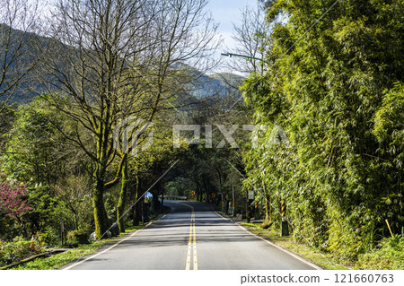View of Yangjin Highway in Yangmingshan National Park, New Taipei City, Taiwan. There are beautiful natural landscapes along the road. 121660763
