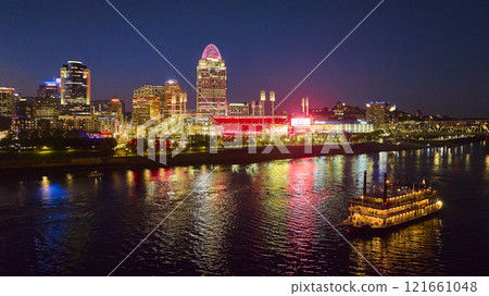Aerial Cincinnati Night Skyline with Riverboat and Ballpark Aerial Cincinnati Night Skyline with Riverboat and Ballpark 121661048