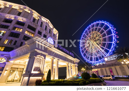 Night view of the E-DA Royal Hotel and the Ferris wheel at the E-DA Theme Park in Dashu, Kaohsiung, Taiwan. Night view of the E-DA Royal Hotel and the Ferris wheel at the E-DA Theme Park in Dashu, Kaohsiung, Taiwan. 121661077