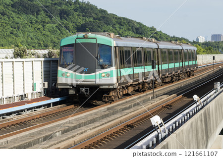 A Red Line train running on the elevated track of the Kaohsiung Rapid Transit System in Taiwan passes by the World Games metro station. 121661107