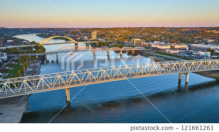 Aerial of Cincinnati Bridges at Golden Hour Over Ohio River 121661261