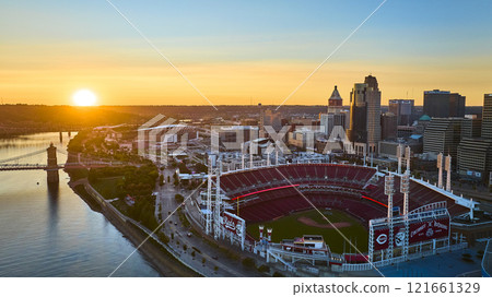 Aerial of Cincinnati Skyline with Ballpark and Roebling Bridge at Sunset 121661329