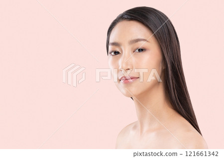 Close up portrait of confident Asian young woman with long, sleek hair, set against a soft pink background, radiant skin and serene expression Close up portrait of confident Asian young woman with long, sleek hair, set against a soft pink background, radiant skin and serene expression 121661342