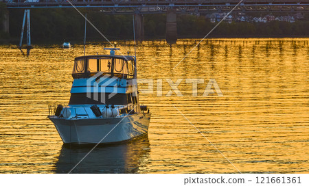 Aerial of Boat on Ohio River Near Cincinnati Bridge at Golden Hour 121661361