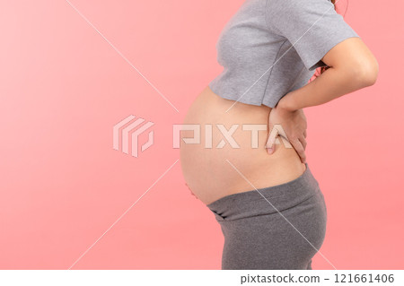 Pregnant woman touching on tummy and on her back so painful,Pregnancy of woman suffering from backache isolated on white stress on her muscle,Health Care of Pregnancy concept 121661406