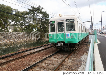 Kotoden train running next to Tamamo Park Kotoden train running next to Tamamo Park 121661456